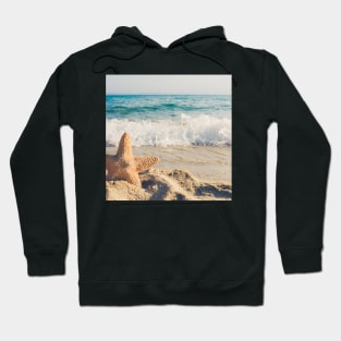 Star fish on the beach Hoodie